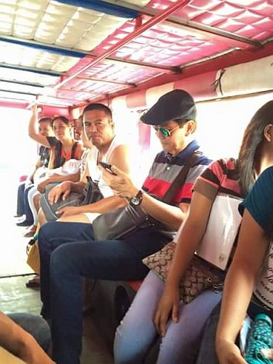 No government-issued car? Suspended Mayor Mike Rama takes a jeepney, accompanied by his police body guard, to an event in T. Padilla on Monday.   (PHOTO/LIM C. ALIX)