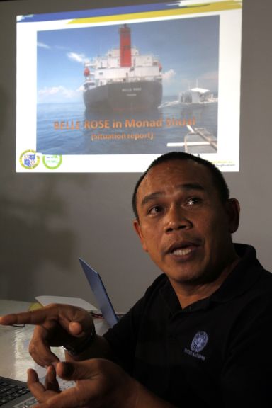 Baltazar Tribunalo, Capitol disaster management chief, shows a photo of the cargo ship MV Belle Rose that ran aground on Monad Shoal while giving updates to media. (CDN PHOTO/JUNJIE MENDOZA)