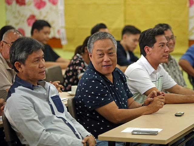 Gov. Hilario Davide III (second from left) and Sta. Fe Mayor Jose Esgana (left) share a light moment during last Saturday’s Bantayan Island Business Summit in Sta. Fe town. (CDN PHOTO/LITO TECSON)