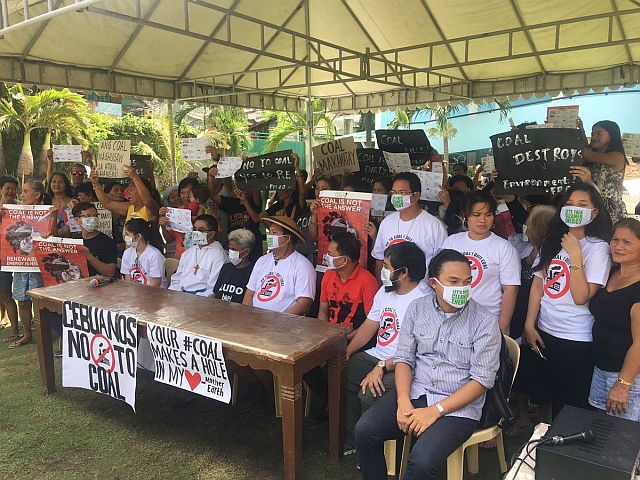 Sawang Calero residents and anti-coal groups wear masks as a symbol of their opposition to Ludo's proposed 300MW coal-fired power plant. (CDN PHOTO/JOSE SANTINO S. BUNACHITA)