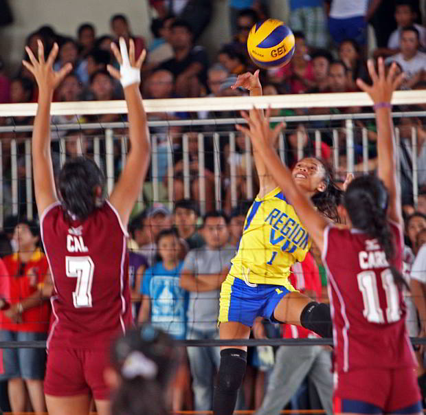 Valerie Orlanes of Region 7 soars for a spike during the elementary girls volleyball competition. (CDN PHOTO/ LITO TECSON)