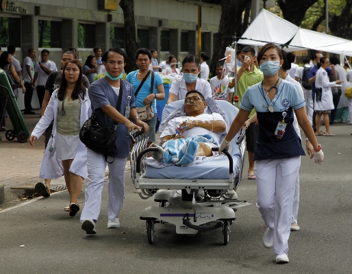 Patients from the Cebu Doctors Hopital are brought outside after a 7.2 magnitude earthquake hitted the Visayas region today.(CDN PHOTO/CHOY ROMANO)