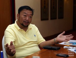 Benedict Reyes, PCSSD commissioner, updates reporters on the public hearings held for revised rules on the scuba diving industry.  (CDN Photo/Lito Tecson)