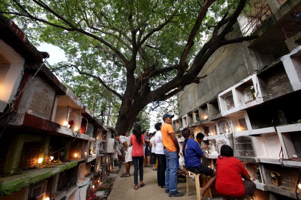 Cebu City residents visit the Carret Cemetery.