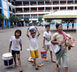 Residents from flood-prone areas in barangays Pasil, Suba and Sawang Calero in Cebu City seek refuge at the Gothong National High School. CDN PHOTO/JUNJIE MENDOZA