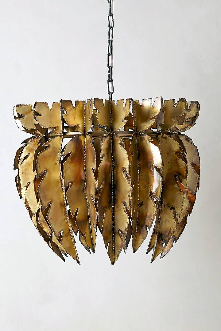 Anthropologie. This chandelier crafted from brass feathers  from Anthropologie makes a striking statement.
