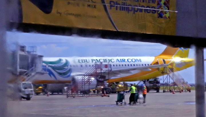 A Cebu Pacific aircraft gets ground servicing at the Mactan Cebu International Airport before taking another flight. (CDN PHOTO/LITO TECSON)
