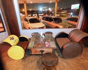 Old license plates used as table tops and oil barrels made into comfortable seats.  CDN photo/Tonee Despojo