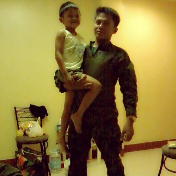 PO2 Wendell Candano carries his son. (Contributed Photo)