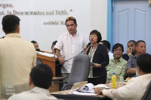 DSWD official Emma Patalinghug (standing with microphone) answers questions from the Provincial Board (PB) and the mayors of northern Cebu towns hit by supertyphoon Yolanda during the PB session.  (CDN Photo/Junjie Mendoza)