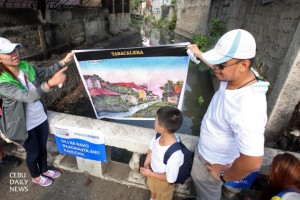 RESTORE THE RIVER. Volunteers show a photograph of the old Tabaclera creek to dramatize their appeal for public support on its restoration in a campaign dubbed as "Siyagit sa Sapa'. (CDN PHOTO/ TONEE DESPOJO)