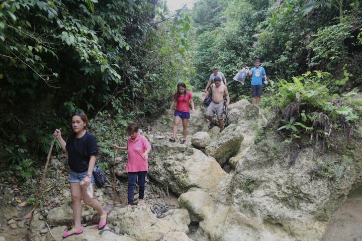 Foreign and domestic visitors take a 30-minute trek to Liki Falls. (CDN PHOTO/ TONEE DESPOJO)