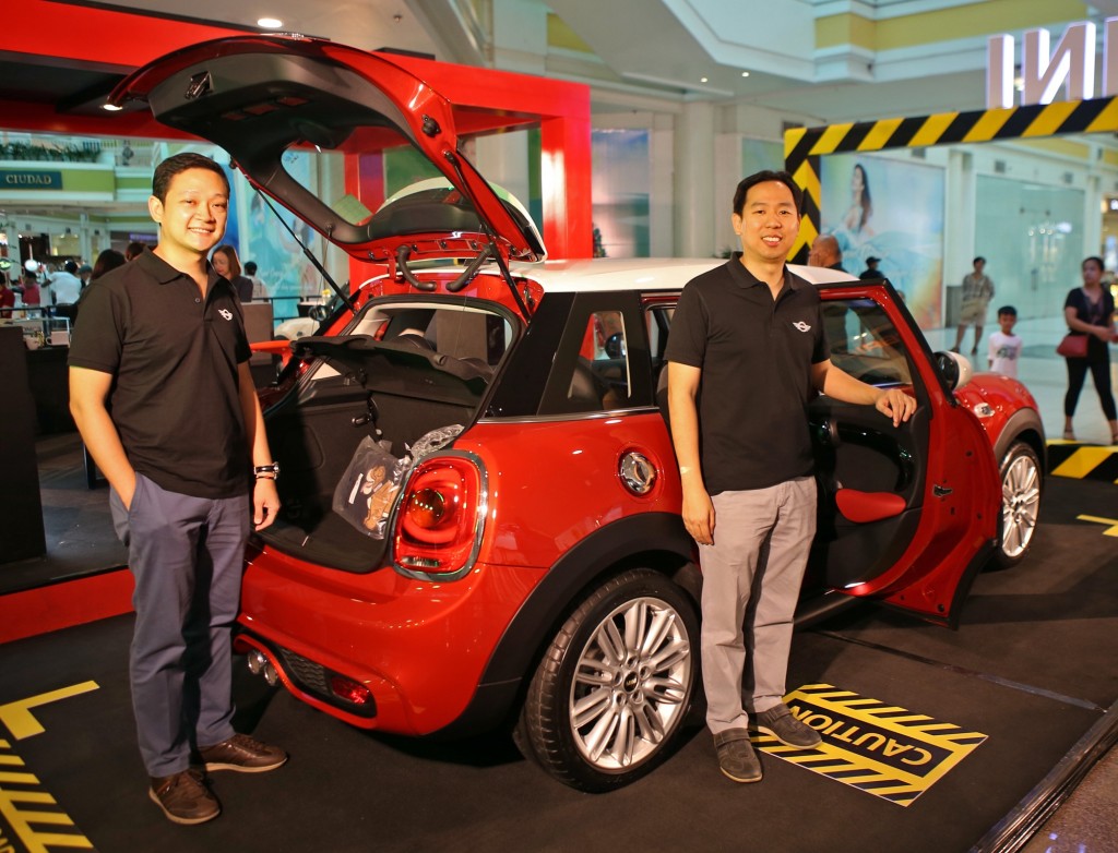 Auto Global Inc. vice president Brian Chua (left) and president Kris Lyndon Go stand beside the new Mini Cooper 5-door hatchback during its launch at the Ayala Center Cebu.  CDN PHOTO/LITO TECSON