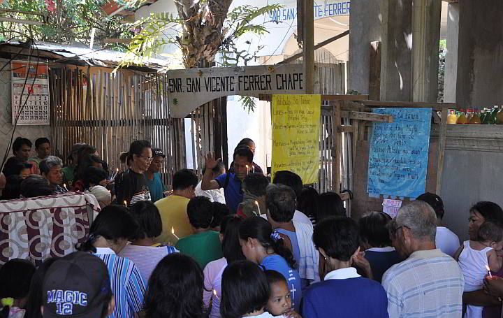 A small crowd gathers at the San Vicente Ferrer chapel which has a clinic for patients. (CDN PHOTO/Christian Maningo)
