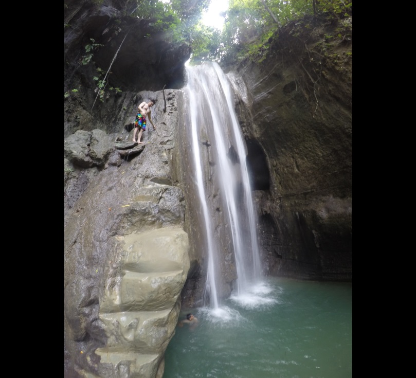 Miguel dela Paz from Quezon City prepares to jump off  what locals call the Hidden Falls,   Binalayan Falls or Triple Drop Falls. (CDN PHOTO/JOSE SANTINO S. BUNACHITA)