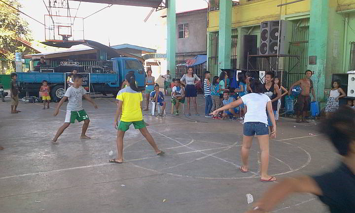 Youths play tubig-tubig, one of the native games revived by barangay Maribago through a contest. (CDN PHOTO/NORMAN MENDOZA)