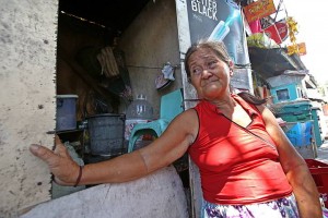 Cecilia Abendan, 60, cries as  she sits in front of her shanty on F.  Ramos Ext. in Barangay Capitol Site because of the impending demolition of  illegal structures in the area. (CDN PHOTO/JUNJIE MENDOZA)