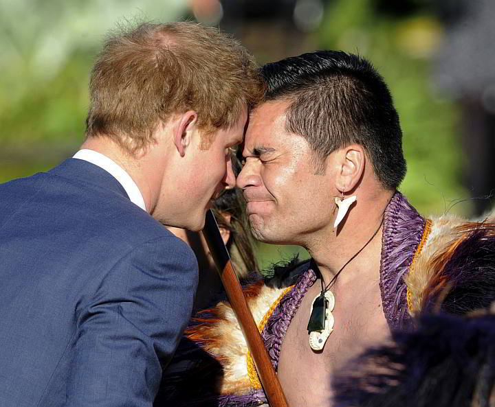 Britain's Prince Harry receives a traditional Maori greeting called hongi, with Kairangi  leader Thomas Vela during a welcome ceremony at Government House, in Wellington, New Zealand yesterday.  (AP)