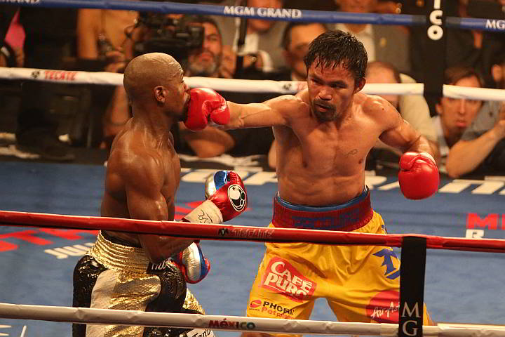 Manny Pacquiao connects anew on a right straight to the face of Floyd Mayweather Jr.  (Inquirer)