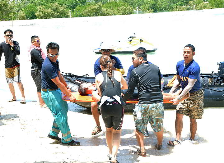 Members of Navforcen who served as lifeguards in 8th Olango Challenge brought Oriondo to shore and rushed him to the hospital. (CDN PHOTO/ CHRISTIAN MANINGO)