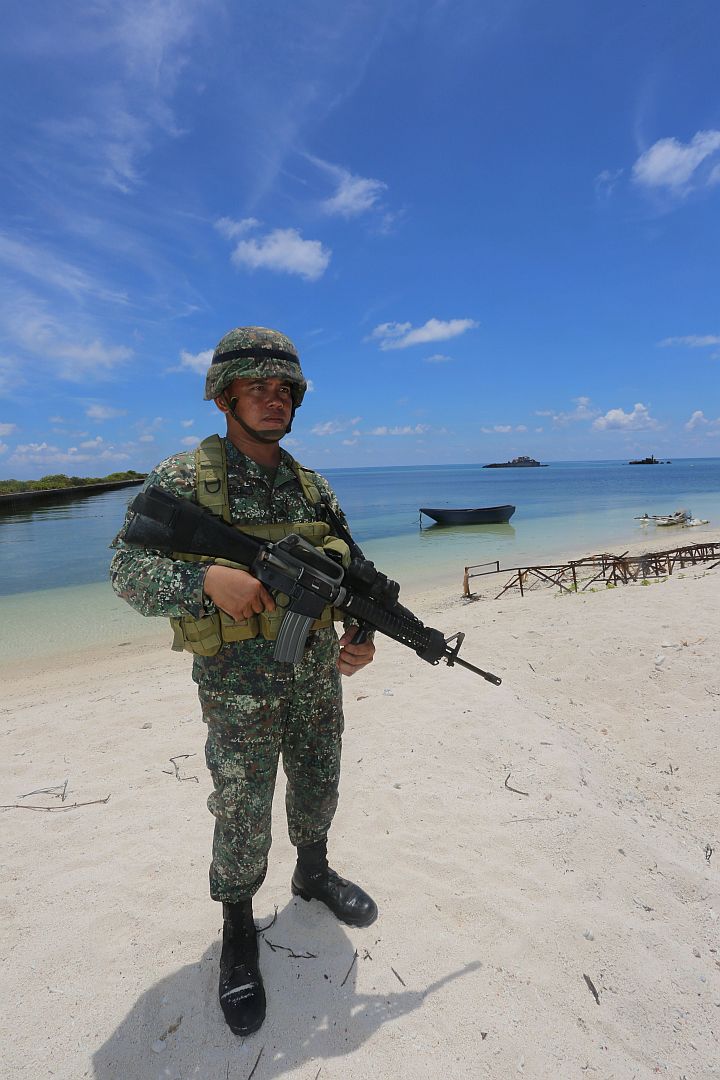 A soldier guards Pag-asa, the only inhabited island among the disputed Kalayan Island Group (Spratlys) in the west philippine sea.