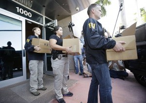 Federal agents carry out boxes of evidence taken from the headquarters of the Confederation of North, Central America and Caribbean Association Football (CONCACAF,) on Wednesday in Miami Beach, Florida.   (AP Photo)