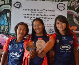 Cebuanas Maddile Salinas (l-r), Mae Ann Ubaub ad Dixie Star Yu of the Philippine Lady Volcanoes show their bronze medal they won in the 28th SEA Games in Singapore.(CDN/CHRISTIAN MANINGO)