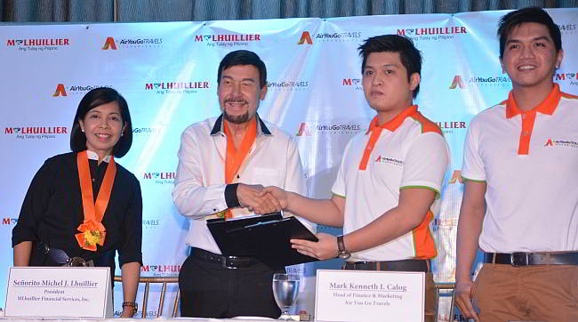 Michel Lhuillier, owner of M. Lhuillier pawnshops, (second from left) and Mark Kenneth Calog (3rd from left), who is one of the co-founders of Air You Go Travels, lead the signing of the partnership agreement of the two companies. (CDN PHOTO/Christian Maningo)