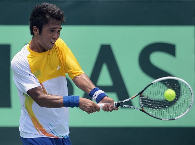 Jeson Patrombon of  the Philippines hits a return against Indonesia's Christopher Rungkat during the final round of the Men's Davis Cup Asia-Oceania Zone group II tennis competition in Jakarta in this September 16,2012 file photo.