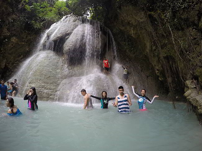 Tourists enjoy a dip at the Aguinid Falls in Samboan (CDN FILE PHOTO)