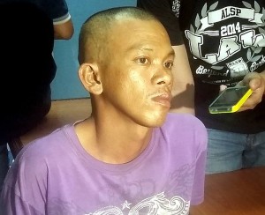 Alfonso Saballa shows no remorse and admits he used drugs before killing his sister-in-law  in Talisay City last Sunday. (CDN PHOTO/APPLE MAE TA-AS)