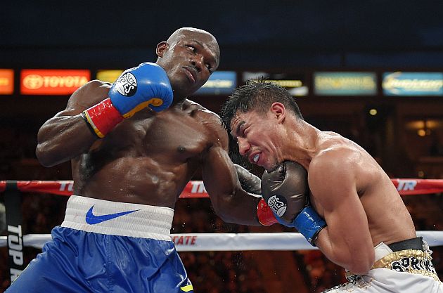 Timothy Bradley, left, connects with Jessie Vargas during a welterweight boxing match for the interim WBO title, Saturday, June 27, 2015, in Carson, Calif. (AP Photo/Mark J. Terrill)