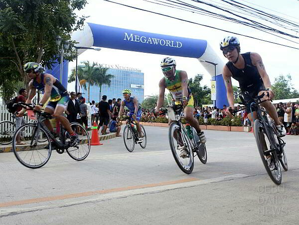 Athletes start to pedal towards Talisay City and back to complete the Ironman 70.3 courses. (CDN PHOTO/ LITO TECSON)