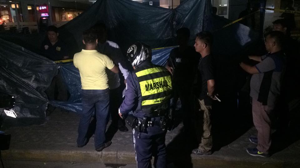 Cebu City Police Officers covered the crime scene in IT Park, Lahug.