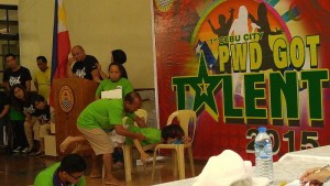 PWDs of barangay Tisa perform an interpretive dance number during the PWD Got Talent show at the Social Hall of Cebu City Hall.  (CDN PHOTO/JULI ANN SIBI)