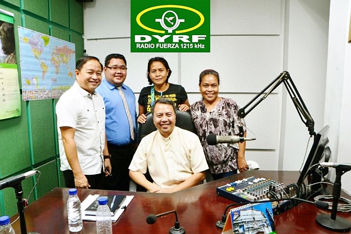 “Panag-ambitay” is aired over radio DYRF every Monday at 8 p.m. with Fr. Randy Figuracion (seated) as one of its hosts.(CONTRIBUTED)