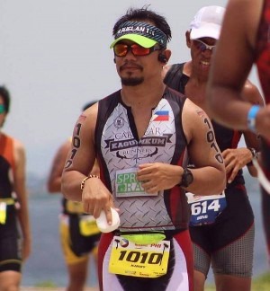 Fr. Brian Brigoli in action on the race course  in last year’s Ironman 70.3 