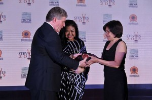 Veco Reputation Enhancement Department head Theresa Sederiosa accepts the award from Stevie Awards president Michael Gallagher in Shanghai, China.(CONTRIBUTED)