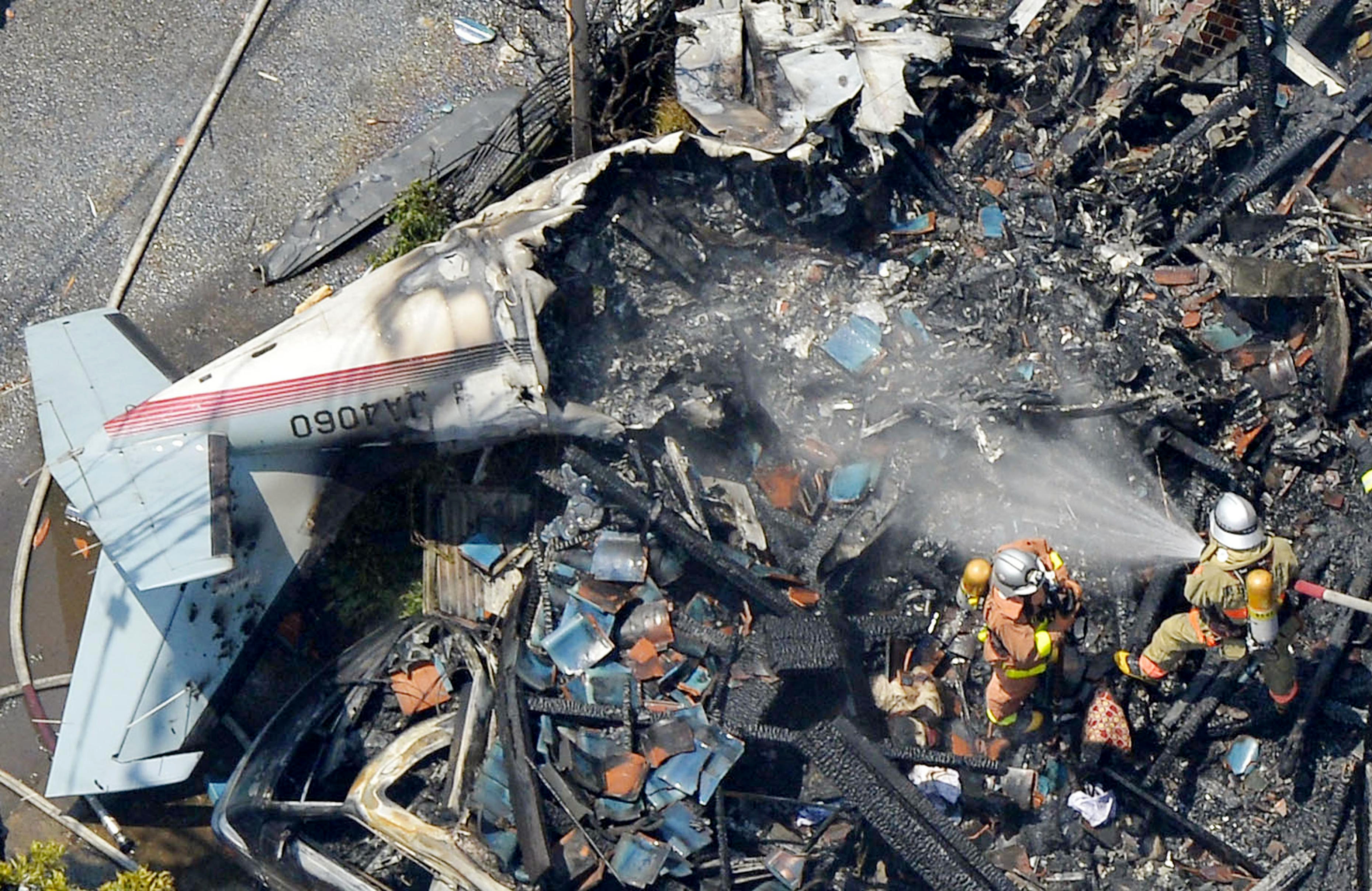 The wreckage of a plane is seen at a crash site in a suburb of Tokyo. (AP)