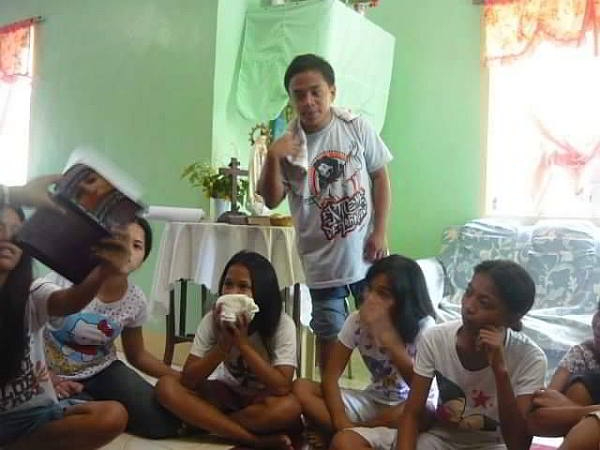 Bryle leads members of Parish Youth Council during a praise and worship session. (Contributed)