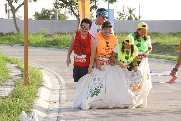 Crimson Resort & Spa Mactan collected a total of P260,000 from participants’ registration fees for the Project Happy Feet Slipper Race, which included a sack race competition (above). (CONTRIBUTED PHOTO)