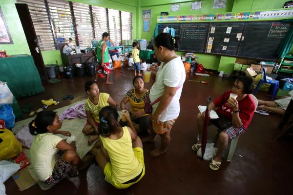 Barangay Sambang 1 fire victims sleep on the classroom floor but they have to prepare to move out of the Cebu City Central School tomorrow. (CDN PHOTO/ JUNJIE MENDOZA)