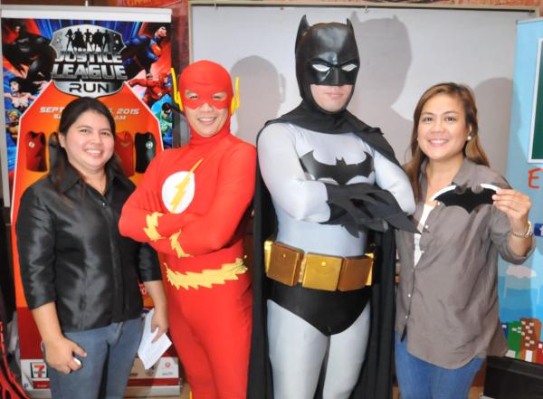 Global Procurement Inc's Mae Geraldine Gauna (left) and Marites Fragrante (right) are joined by cosplayers during yesterday's launching of the Justice League Run at Shakey's SM City Cebu. (CDN PHOTO/ CHRISTIAN MANINGO)