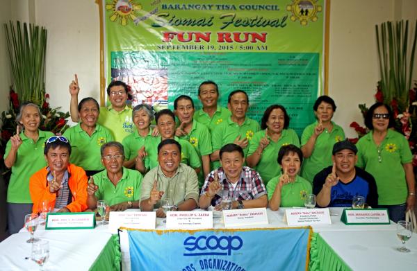 The organizing group of the Siomai Festival Fun Run headed by Tisa barangay captain Philip Zafra (seated, third from left) join Bobby Inoferio (seated, fourth from left) in the Scoop Forum at the Tisa Barangay Hall. (CDN PHOTO/ LITO TECSON)