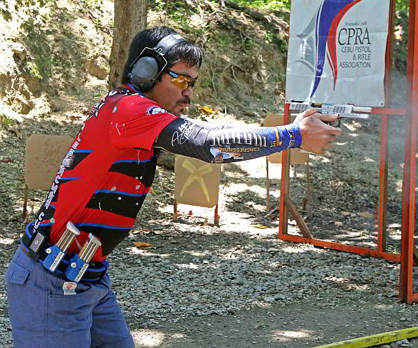 Manny Pacquiao tries his shooting skills at the CPRA firing range in barangay Pusok, Lapu-Lapu City. (CDN PHOTO/LITO TECSON)
