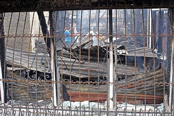 The iron grills on the house of retired judge Delfin Desiderdo prevented him from using the windows  as an emergency exit when fire struck in Honeyville, barangay Quiot, Cebu City. (CDN PHOTO/LITO TECSON)