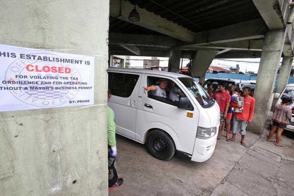 A closure order is posted on the wall of the One Citilink Terminal on July 28. (CDN FILE PHOTO)