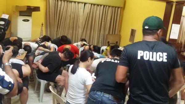 Most of those arrested were Taiwanese men and women like this group in a two-storey house in Casal's subdivision in Mabolo, which police said was used as an operation base of a syndicate to blackmail and defraud businessmen in Taiwan and mainland China. Computers, routers, headsets, and VOIP gateway machines were confiscated. (CDN PHOTO/ APPLE TAAS)