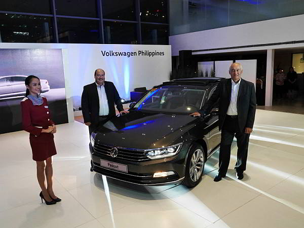 Volkswagen Philippines president and chief executive officer John Philip Orbeta (left) and VW Philippines Chief Operating Adviser Klaus Schadewald stand beside the Passat during its preview last Friday.  (motioncars.inquirer.net)