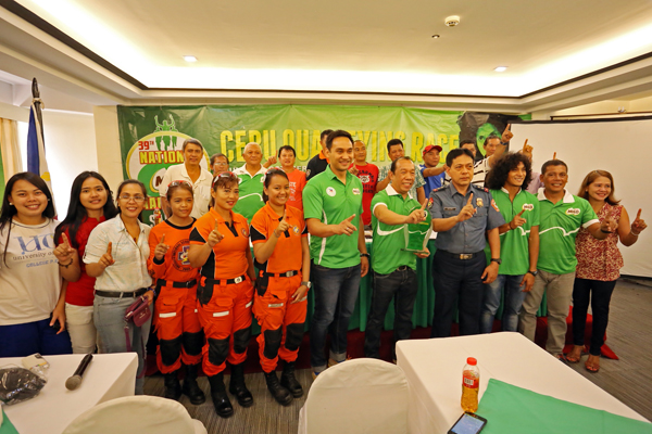 Milo Marathon organizers, headed by Andrew Neri (sixth from left),  gather for a photo op during a press conference for the Cebu leg at the Cebu Grand Hotel. CDN PHOTO/LITO TECSON